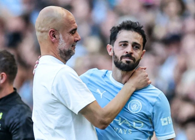 Pep Guardiola và cậu học trò cưng Bernardo Silva, người có nhiều trận đấu nhất dưới thời ông.